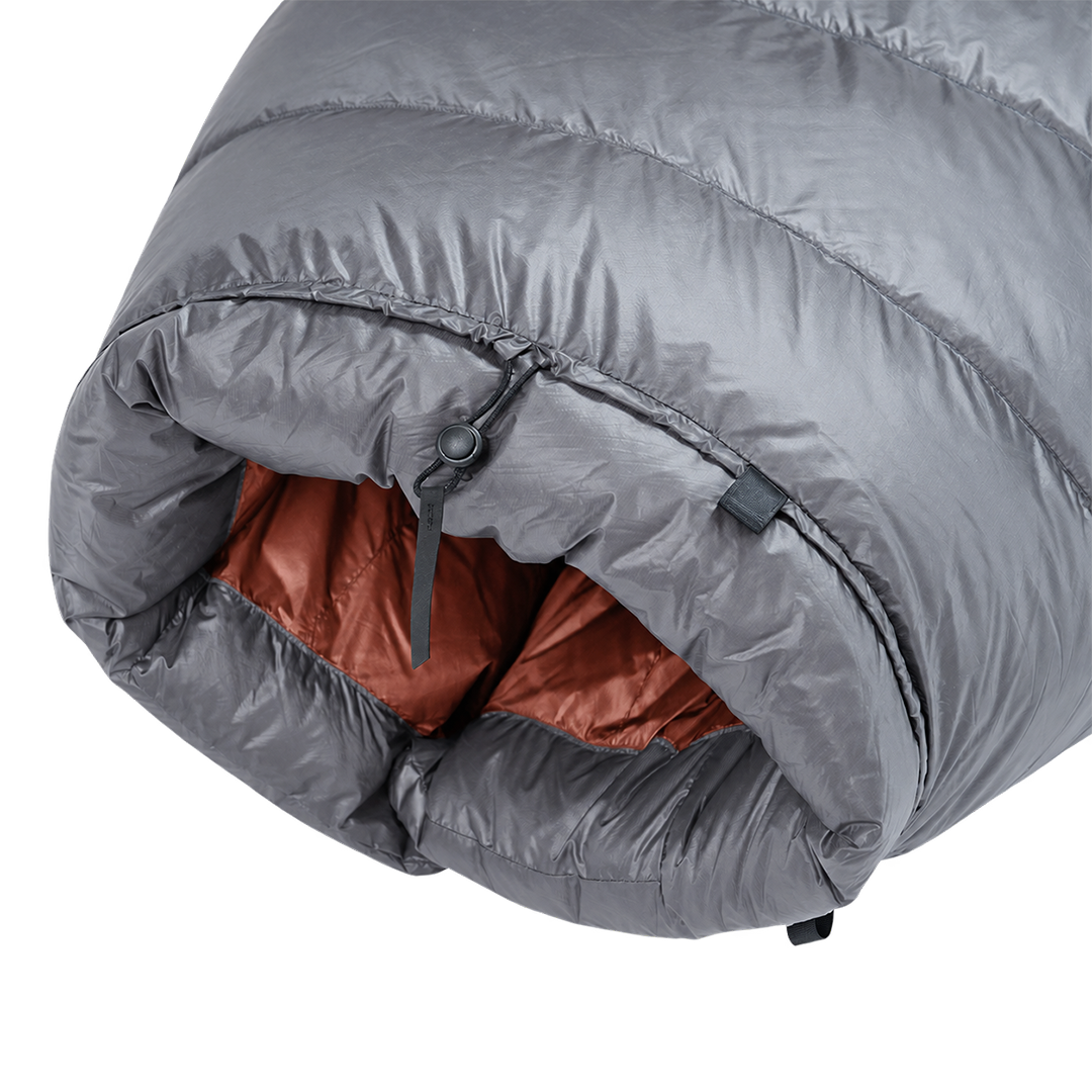 Detailed view of the cinched top neck collar with adjustable cord lock and insulated draft baffle on the red Outdoor Vitals StormLoft Down TopQuilt.