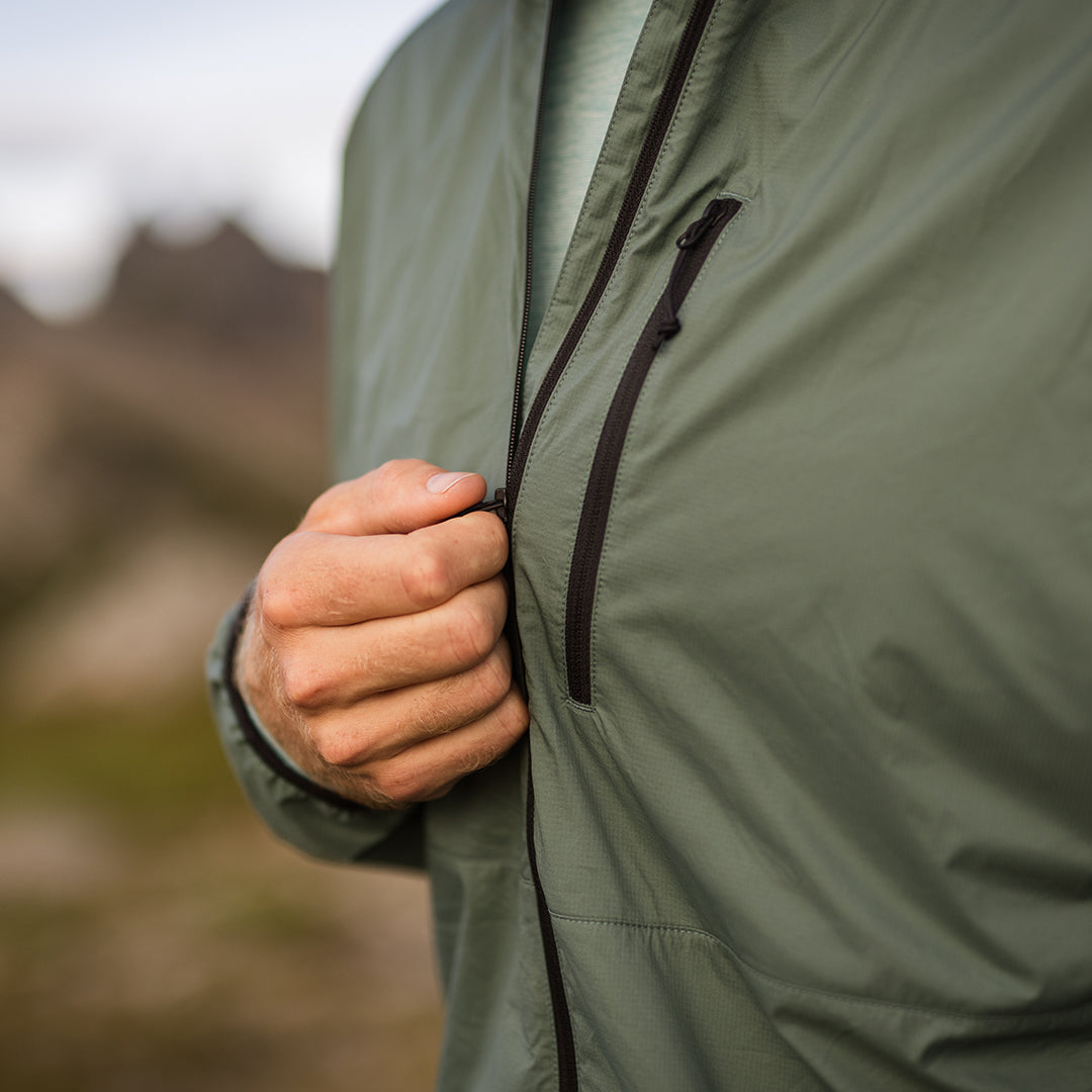 Nebo Windbreaker front zipper detail, Close-up of Nebo Windbreaker chest pocket, Nebo Windbreaker zipper view